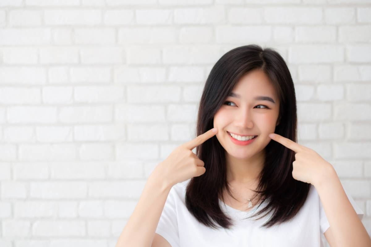 Woman smiling with bright teeth from cosmetic dentistry