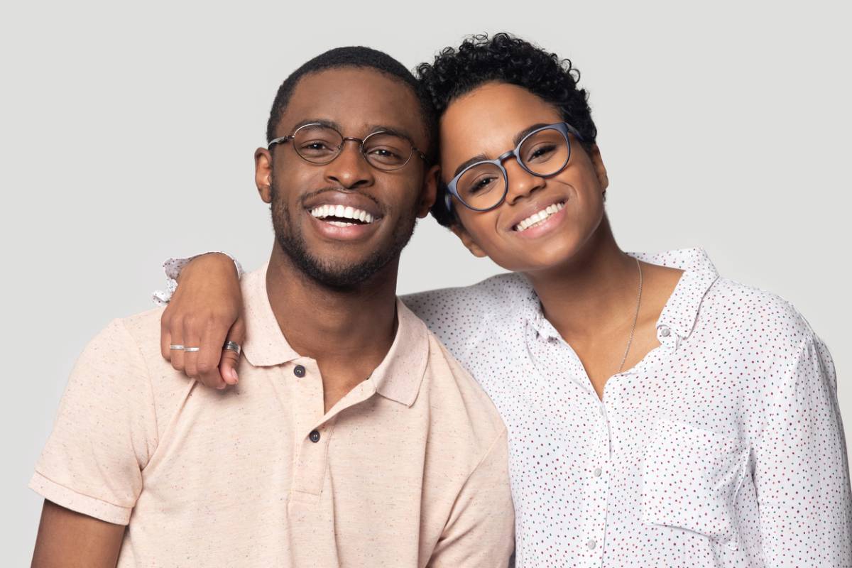 concept image of couple with dental bonding white smiles